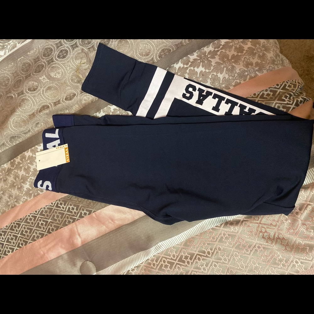 Blue Leggings that say “Dallas”.